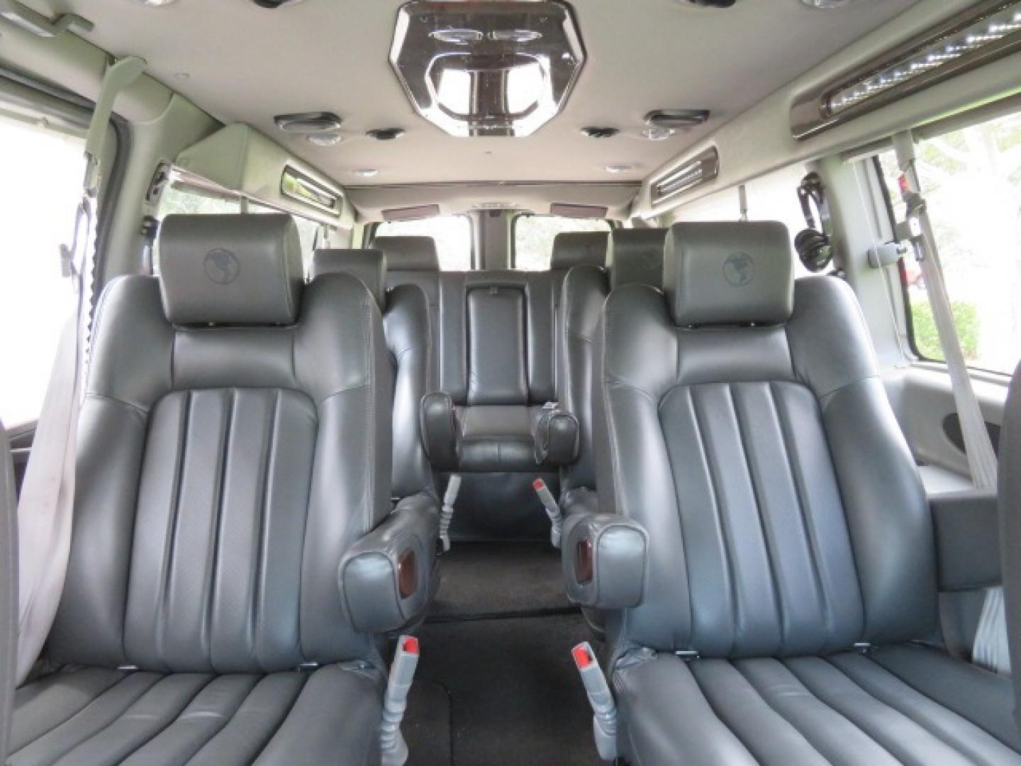 2014 Chevrolet Express (1GBWGLCG3E1) , located at 4301 Oak Circle #19, Boca Raton, FL, 33431, (954) 561-2499, 26.388861, -80.084038 - You are looking at a Rare 2014 Chevy Express 2500 Quigley 4x4 Four Wheel Drive Explorer Limited SE 9 Passenger Conversion Van with: 107K Original Miles, 6 Captain Chairs, Rear Power Folding Bench Seat Bed, Center Consoler Cooler, Front PPF (Paint Protection Film) Explorer Limited Conversion Througho - Photo#53